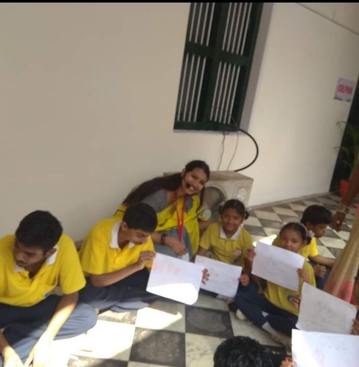 Deepa Kiran sitting with kids in a workshop